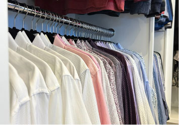 shirts hanging in a closet